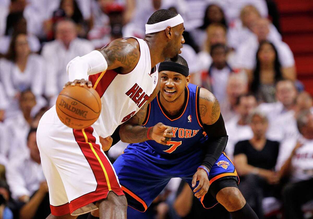 Miami's LeBron James is defended by Carmelo Anthony of the Knicks during Monday's playoff game.