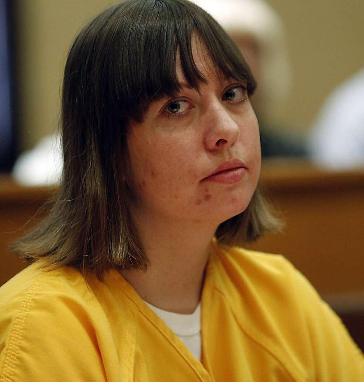 Lee Grace Dougherty is pictured in district court where she,was sentenced to 24 years in prison on charges stemming from her and her brothers and their shootout and capture in Colorado during district court in Walsenburg, Colo., on Monday, April 30, 2012. All three siblings were sentenced on Monday. The three are accused of shooting at a police officer and staging a daring bank robbery in a cross-country crime spree that included Georgia and Florida. The manhunt for them ended after an Aug. 10 freeway chase and shootout with police in southern Colorado. (AP Photo/Ed Andrieski, Pool)