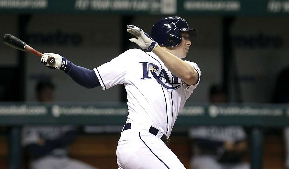 Tampa Bay Rays' Elliot Johnson watches a 12th-inning RBi single off Seattle Mariners relief pitcher Brandon League that scored Ben Zobrist with the winning run during a baseball game Monday, April 30, 2012, in St. Petersburg, Fla. The Rays woin 3-2. (AP Photo/Chris O'Meara)