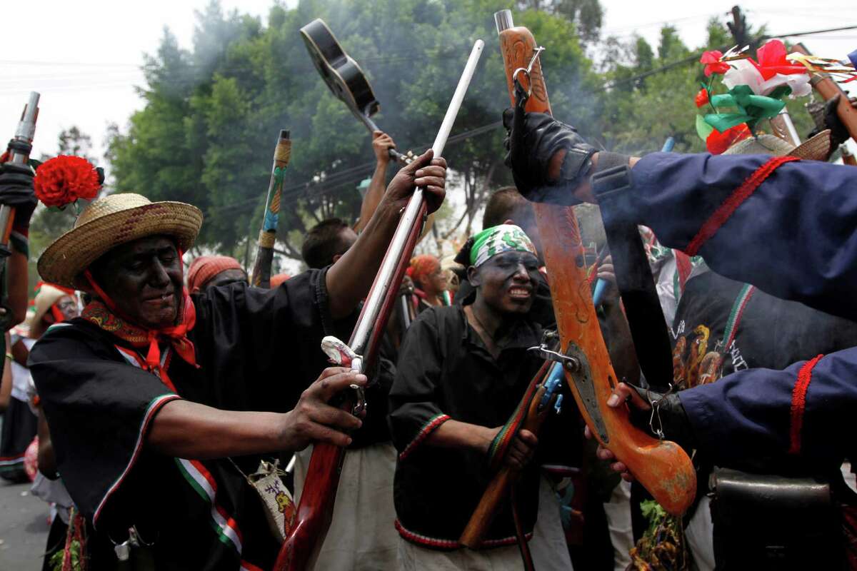 People take part in a recreation of the Battle of Puebla during "Cinco de Mayo" celebrations in Mexico City, Thursday, May 5, 2011. On May 5, 1862, Mexican forces loyal to Benito Juarez defeated French troops sent by Napoleon III in the Battle of Puebla, in Puebla, central Mexico.