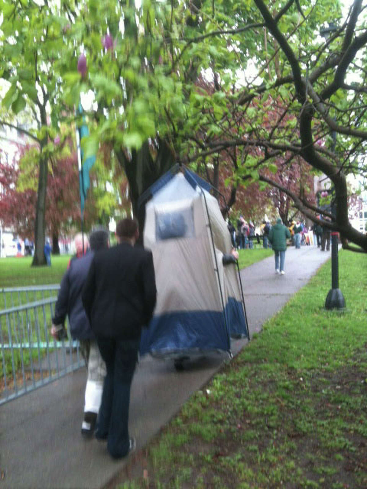 Tom Rostocki, 50, of Colonie carries his tent into Lafayette Park in Albany on Tuesday, May 1, 2012. (Bryan Fitzgerald / Times Union)