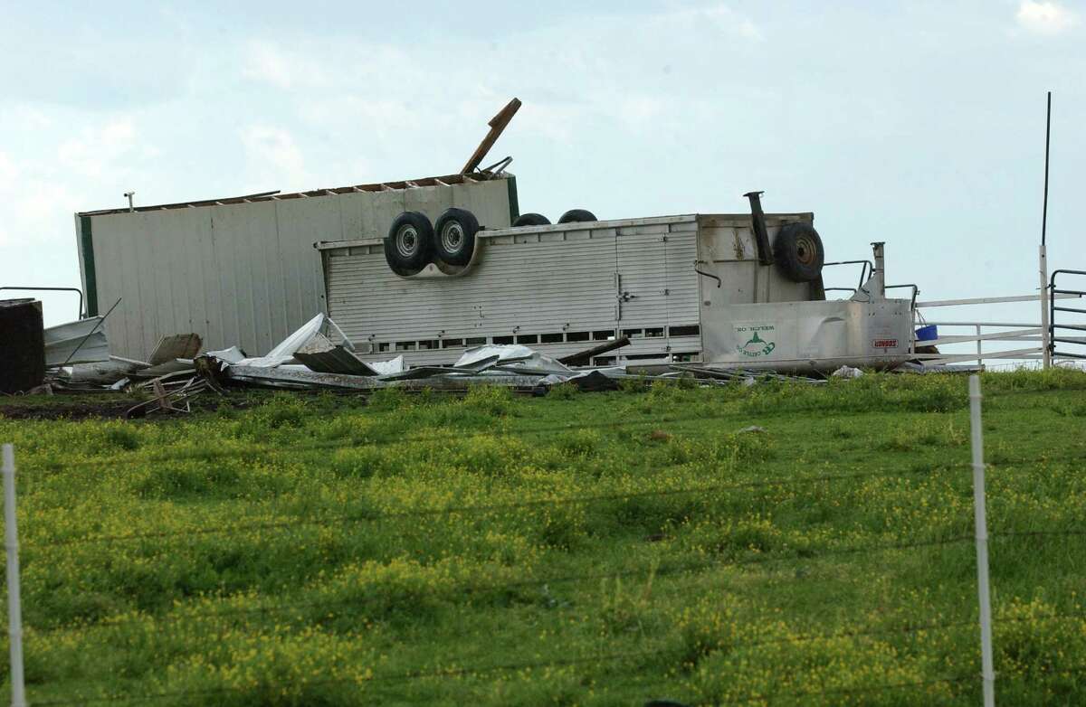 A trailer and debris is scattered by the early morning storm that hit, Tuesday, May 1, 2012 in Welch, Oka. Tornadoes that struck northern Oklahoma damaged some homes, barns and other farm structures and left more than 1,000 customers without power, officials said Tuesday. Authorities said no deaths or serious injuries were reported as a result of the twisters that struck between 8 p.m. and 9 p.m. Monday near Medford in north-central Oklahoma and near Nowata in the state's northeastern corner. (AP Photo/Tulsa World, Gary Crow ) ONLINE OUT; TV OUT; TULSA OUT (REV-SHARE)