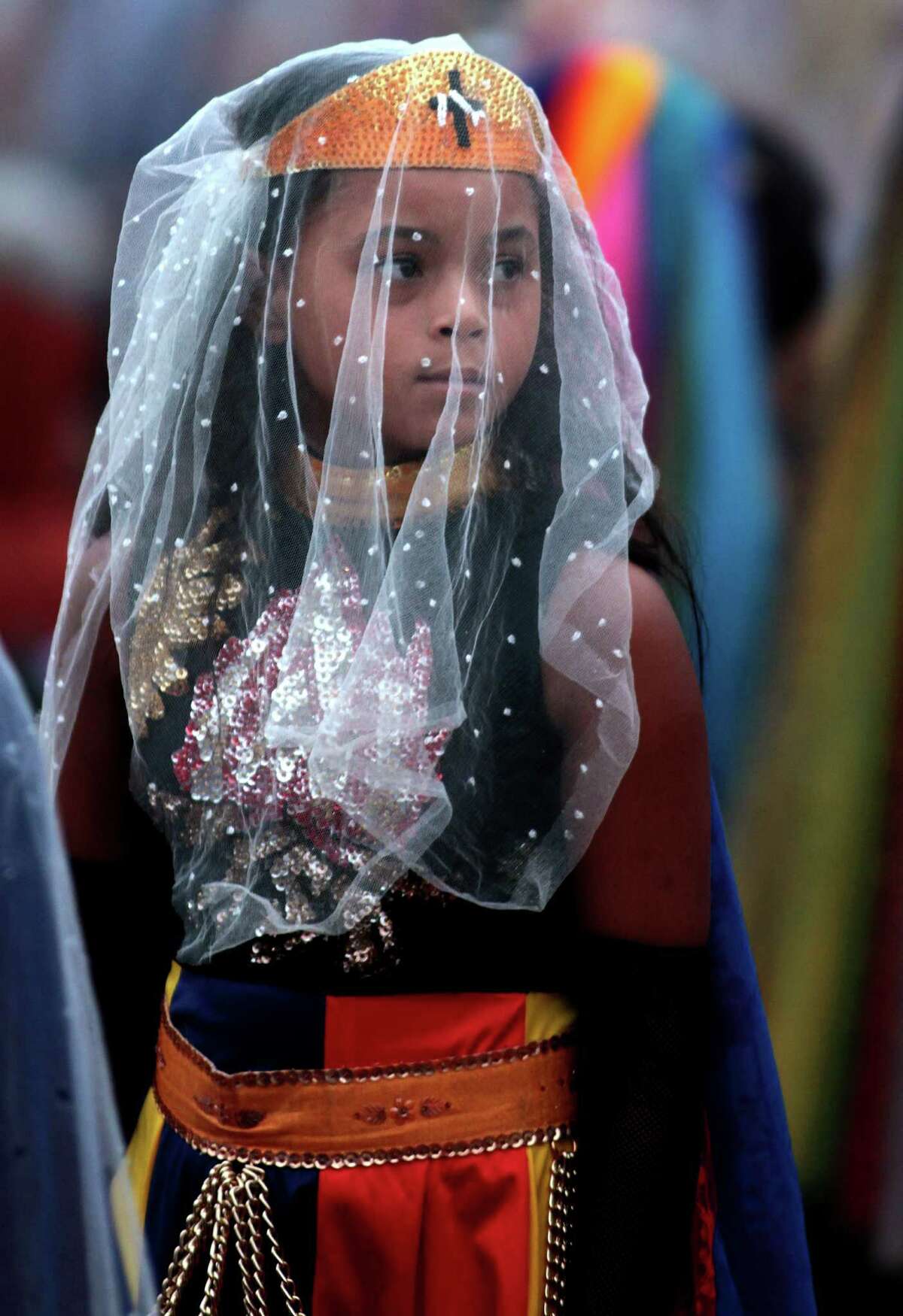 A girl attends the ritual of the ellipse at the annual festival of the Vale do Amanhecer, or Sunrise Valley Festival, in Planaltina, Brazil, Tuesday, May 1, 2012. Vale do Amanhecer is a spiritual community founded in 1959 by the medium Tia Neiva and its doctrine contains elements from Christianity, Spiritualism, Mysticism, Afro-Brazilian religions and ancient Egyptian beliefs. The community has more than 600 temples throughout Brazil and other countries. (AP Photo/Eraldo Peres)
