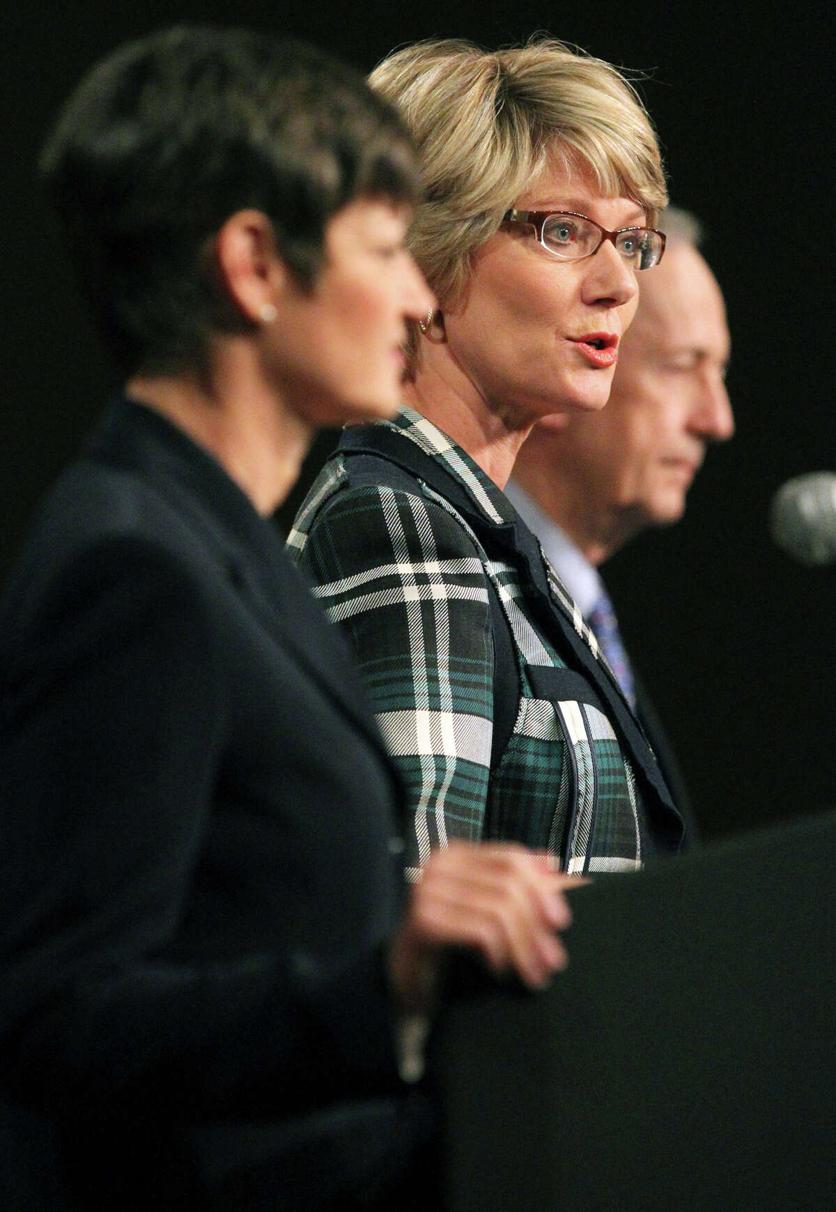 In this Wednesday, Feb. 8, 2012, photo, Texas Senate District 25 candidate Elizabeth Ames Jones, Chairman of the Texas Railroad Commission, center, speaks during a debate held by The Greater San Antonio Chamber of Commerce at the Pearl Stable, in San Antonio, Texas. On the left is candidate Dr. Donna Campbell, and on the right is incumbent Senator Jeff Wentworth. On April 21, 2012, at the state Capitol, Texas senators talked about being friends with their colleagues and stick to polite decorum during even the most contentious of debates. (AP Photo/The San Antonio Express-News, John Davenport) RUMBO DE SAN ANTONIO OUT;