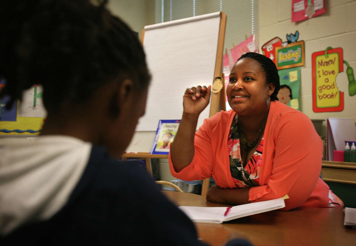 Candice King Sadler, one of two recipients of the annual Beard Award for excellence in teaching, works on reading with her first grade class at Cesar Batalla School in Bridgeport on Wednesday, May 2, 2012.