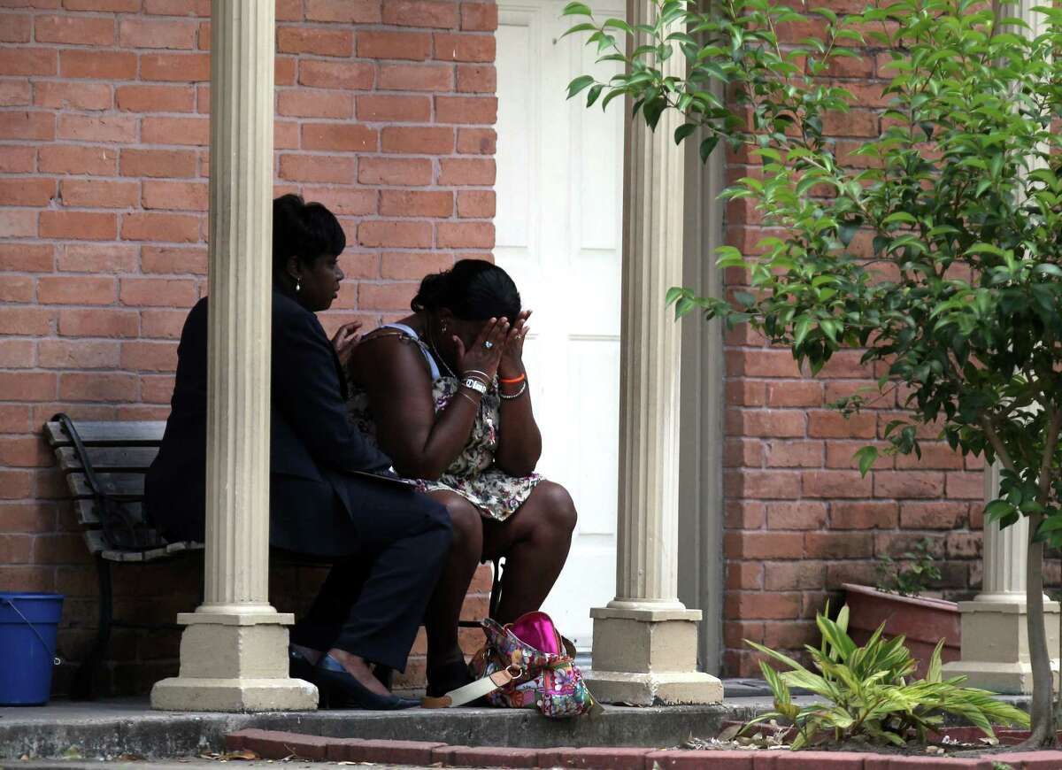 A mother reacts while speaking with HPD Homicide Sgt. Ora Chandler, left, as police investigate the death of her near 6-month-old son who was found in the refrigerator by firefighters where he lived with his father at The University Apartments on the 7100 block of Beechnut Wednesday, May 2, 2012, in Houston. Investigators say the baby's father called 911 this morning, saying he was suicidal. When rescue personnel arrived at the apartment around 7:40 a.m. no one opened the door. Neighbors told firefighters that a baby was in the apartment. Fearing for the child's safety, firefighters broke into the unit and found the father collapsed on the floor. He was incoherent and said he had killed his son, police said. The baby was found wrapped in a blanket, dead in refrigerator. The father, who has not been identified, became violent and had to be subdued. He was taken to a hospital where he remains.