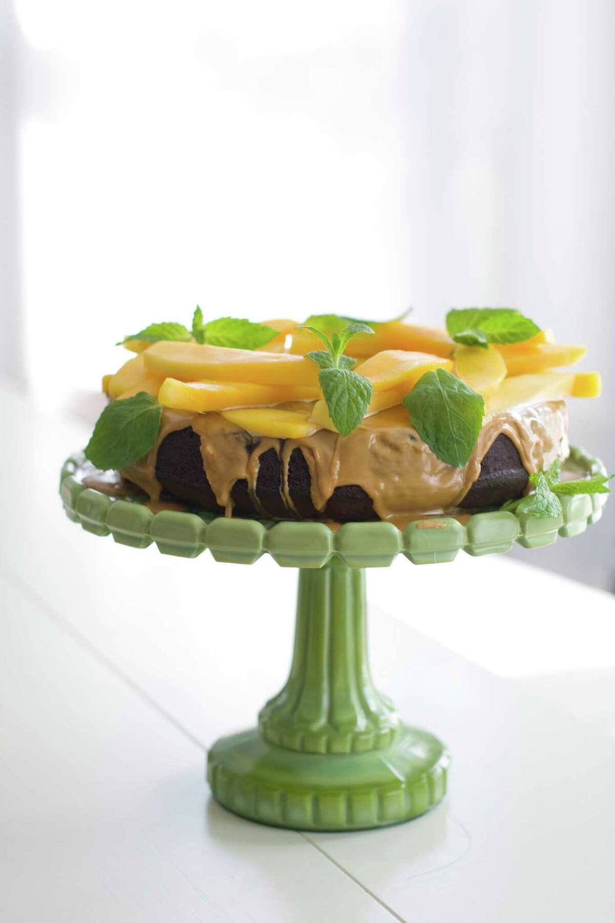 In this image taken on March 26, 2012 a mango-topped chocolate honey cake is seen in Concord, N.H. (AP Photo/Matthew Mead)