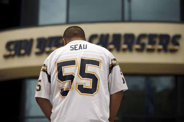 New England Patriots Junior Seau smiles while holding up the Lamar Hunt  trophy after the AFC Championship game against the San Diego Chargers at  Gillette Stadium in Foxboro Massachusetts on January 20