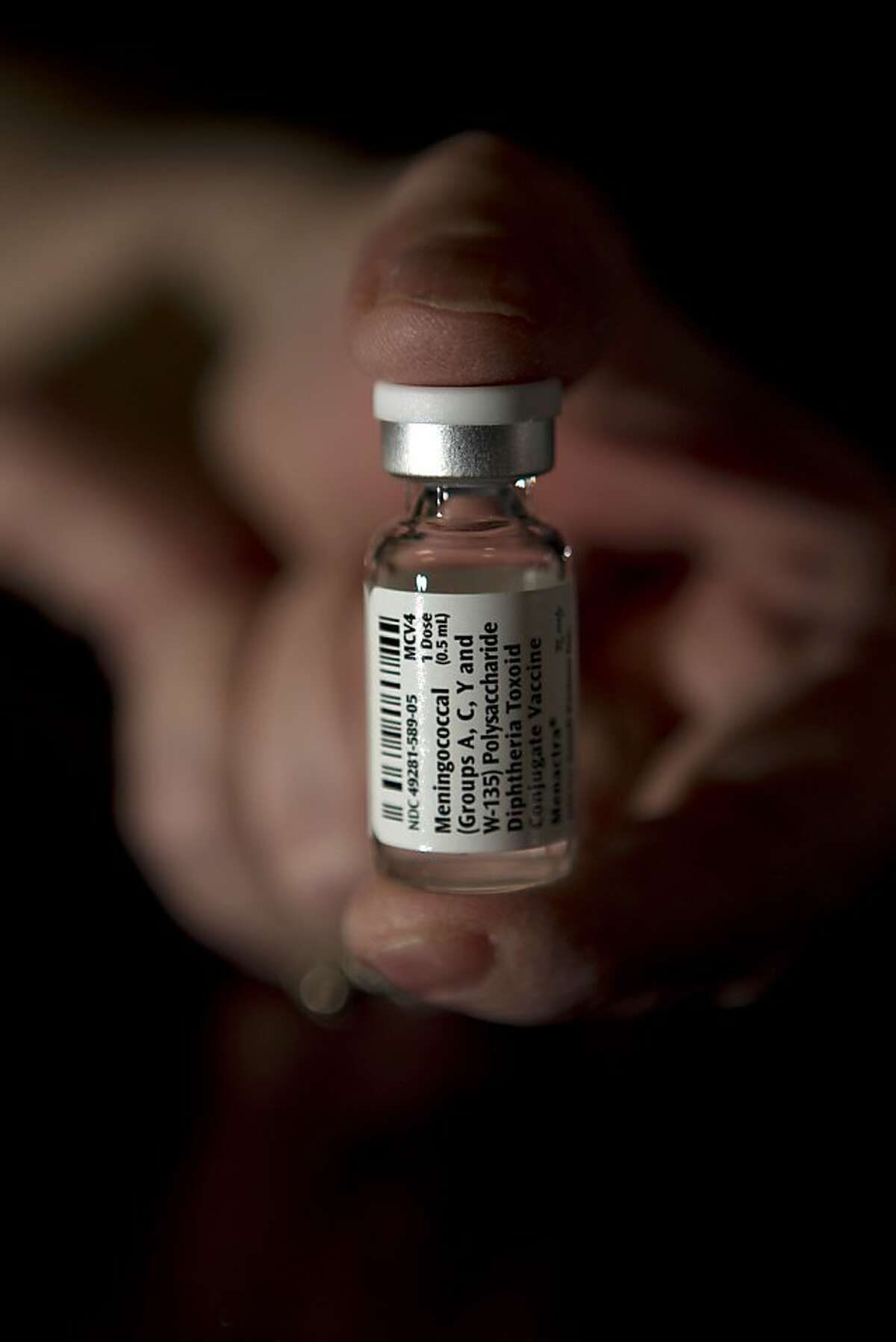 In this file photo, a nurse holds a meningococcal vaccine dose. The vaccine protects against most types of meningococcal disease.