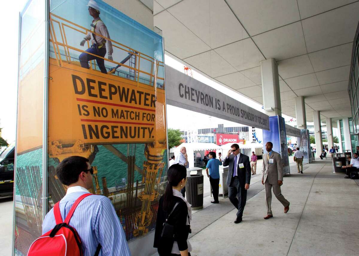 Attendees walk outside Reliant Center during the 2012 Offshore Technology Conference Thursday, May 3, 2012, in Houston.
