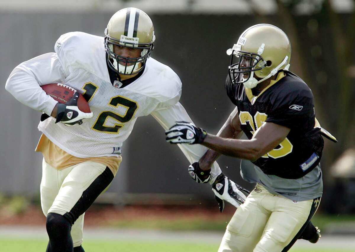 CHUCK COOK / THE TIMES-PICAYUNE Wide receiver Marques Colston, left, tries to get away from defensive back Danny Gorrer on the first day of New Orleans Saints training camp at their training facility in Metairie Friday, July 31, 2009.
