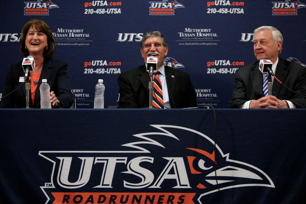 UTSA President Dr. Ricardo Romo, center, with athletic director Lynn Hickey, left, and Chairman of the Greater San Antonio Chamber of Commerce Football Task Force John Montford, right, announce the UTSA Roadrunners entry to Conference USA during a press conference at the university in San Antonio on Friday, May 4, 2012. Lisa Krantz/San Antonio Express-News