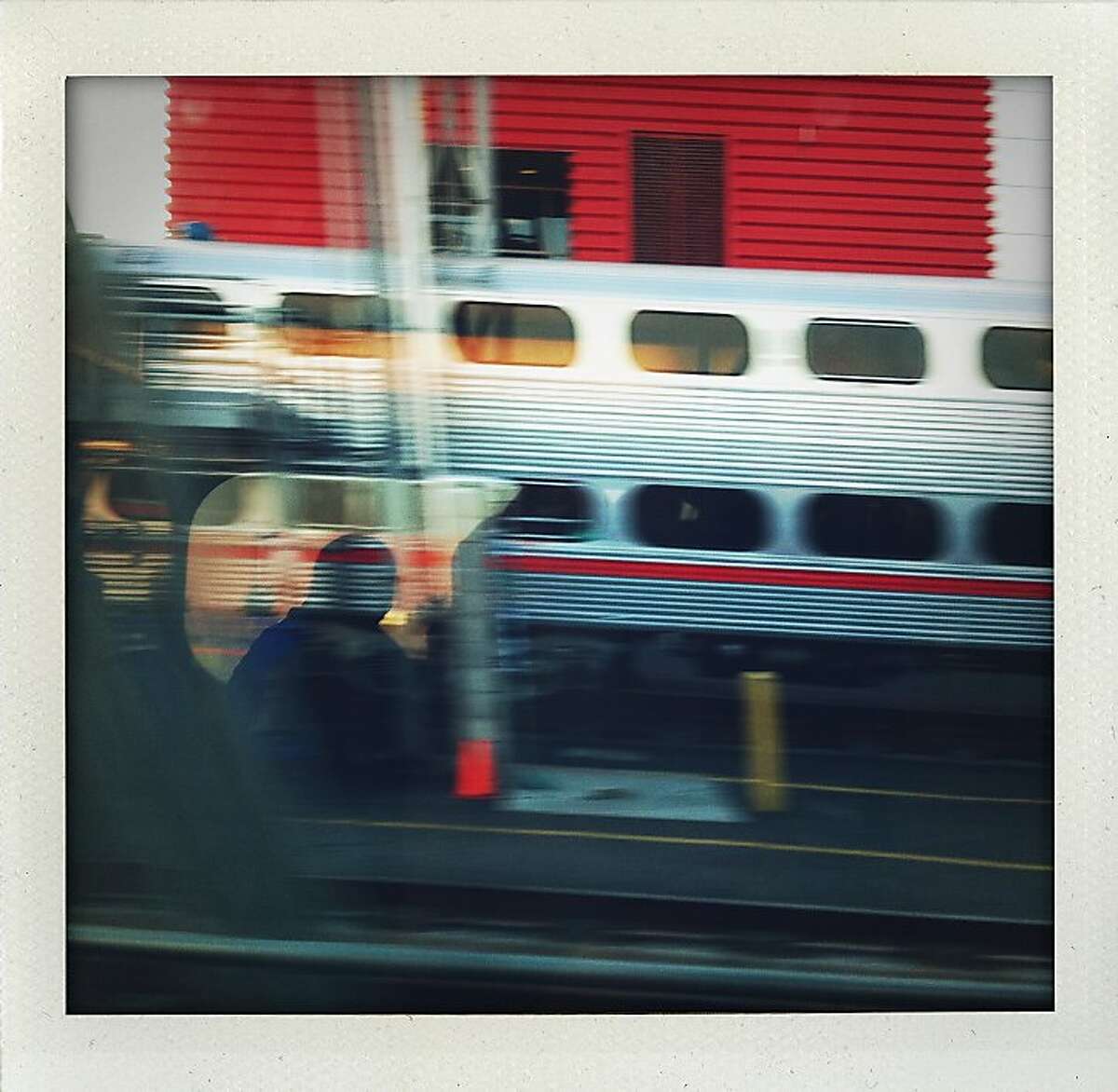 "Cal's Train" - Reflection on a window while leaving the northern terminus of Caltrain, looking west.
