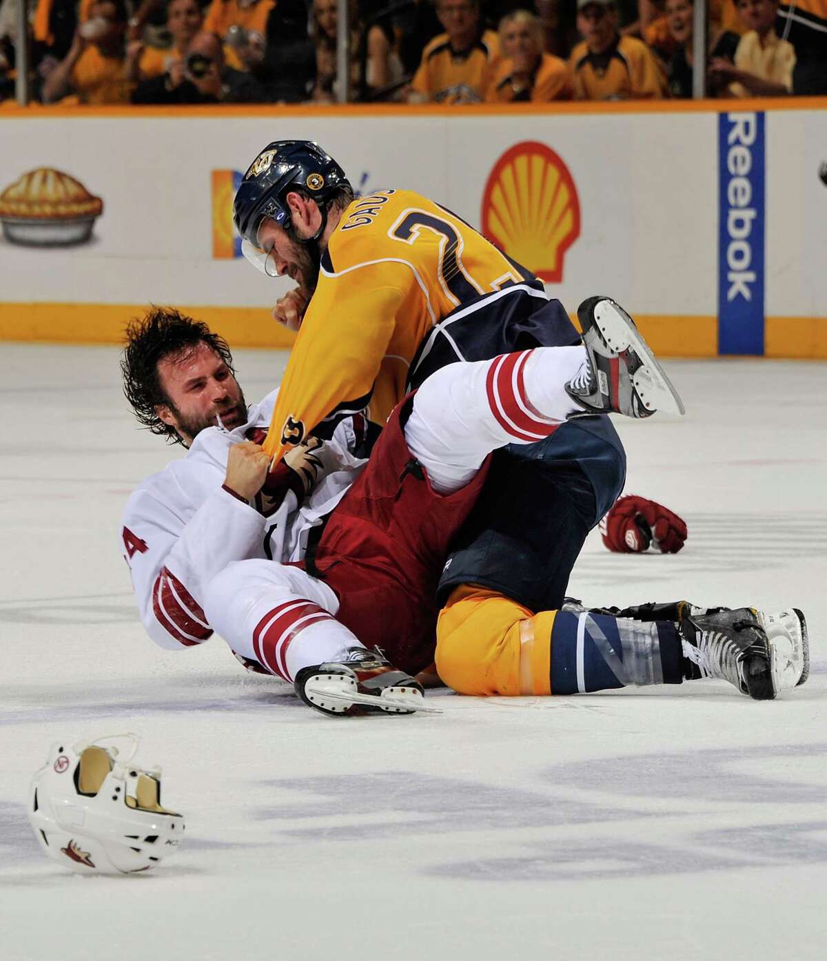The Predators' Paul Gaustad gets the upper hand on the Coyotes' Kyle Chipchura during the first period.