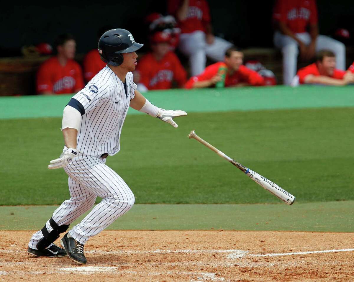 Rice University's Michael Ratterree drops the bat after hitting the ball for a base hit against the University of Houston's during the fourth inning of college baseball game action at Reckling Park Saturday, May 5, 2012, in Houston.