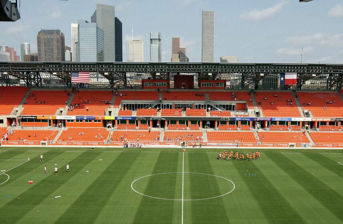 Fans watch as the Houston Dynamo soccer team practices at BBVA Compass Stadium Saturday, May 5, 2012, in Houston.
