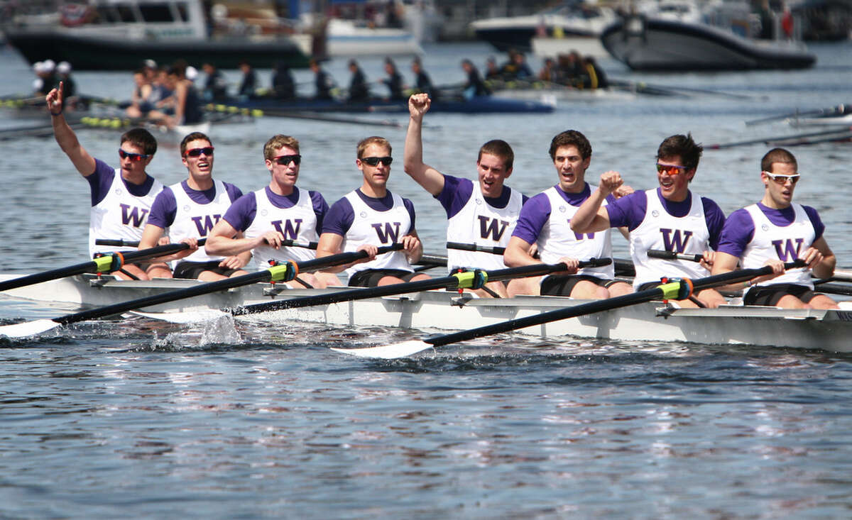 The University of Washington's men's varsity eight crosses the finish line to win the Windermere Cup during the annual regatta in the Montlake Cut on Saturday, May 5, 2012. The regatta and boat parade are the annual kickoff to the boating season in Seattle.