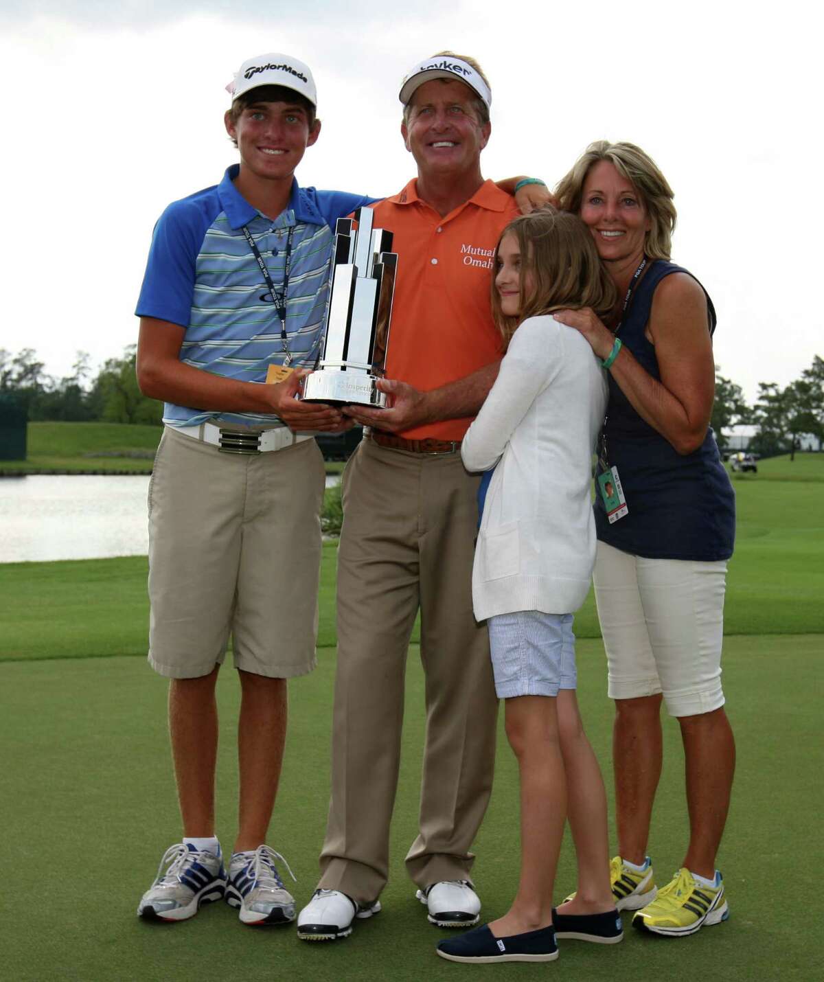 Final round, May 6 - Fred Funk (second from left) and family, Taylor (left), Perry, and wife Sharon pose with Funk's winner's trophy after Funk won the Insperity Championship, Sunday, May 6, 2012 at the Tournament Course in The Woodlands, TX.