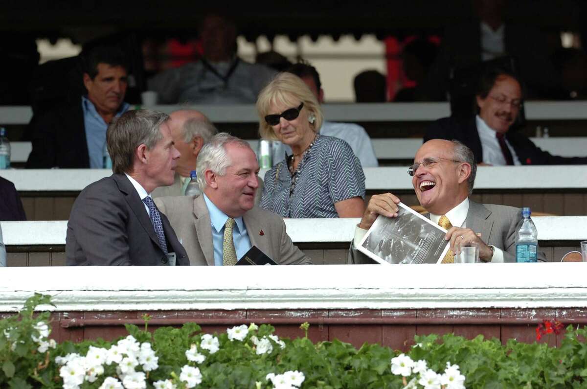 In this photo released by New York Racing Association, Republican presidential hopeful former New York Mayor Rudy Giuliani, right, reacts as he watches a race at Saratoga Race Course in Saratoga Springs, N.,Y., Thursday, Aug 16, 2007. He is joined by New York Racing Association Chairman of the Board C. Steven Duncker , left, and New York Racing Association President Charles E. Hayward, second left. (AP Photo/ New York Racing Association, Adam Coglianese) ** NO SALES**