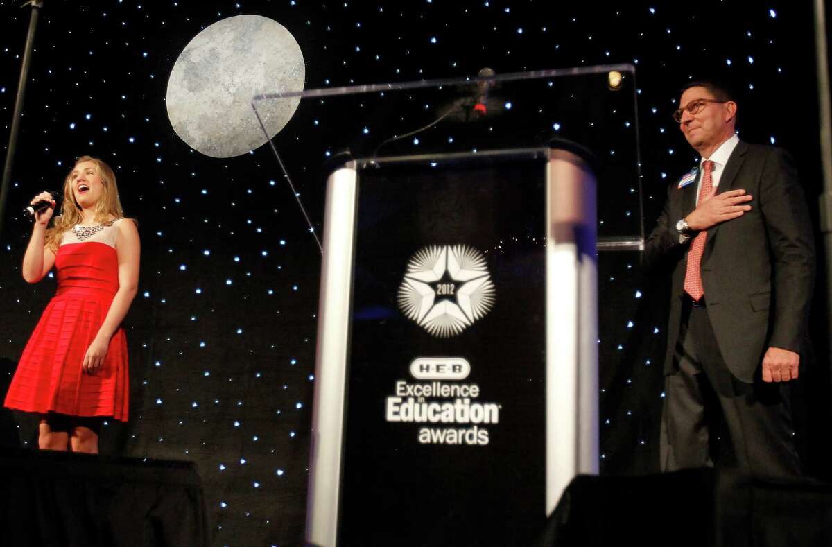Morgan Starr, a junior at Klein Oak High School, sings the National Anthem while Scott McClelland, H-E-B president, Houston Food and Drug division covers his heart during the 2012 H-E-B Excellence in Education Awards at the InterContinental Hotel, Sunday, May 6, 2012, in Houston. Now in its 11th year, the program added a new Early Childhood Award to support public and private schools and not-for-profit learning agencies that focus on kinder readiness and the care of children under five. Five outstanding early childhood facilities are among the 65 educators, school districts, educators and "healthy" campuses that have been named finalists in the 2012 Excellence in Education program.