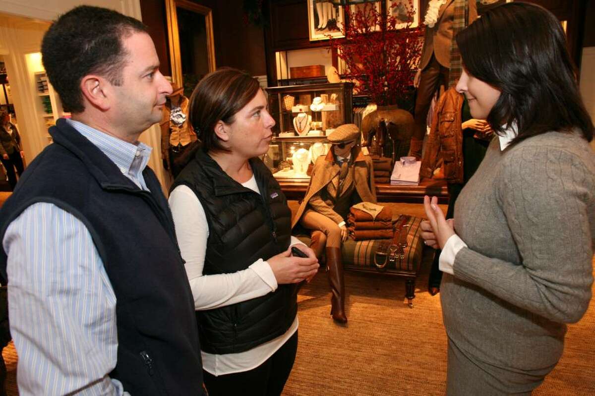 Cathy and Robert Carangelo spoke with Ralph Lauren sales associate Jasmine Bezirdjian during opening day of the new retail shop on Greenwich Avenue.
