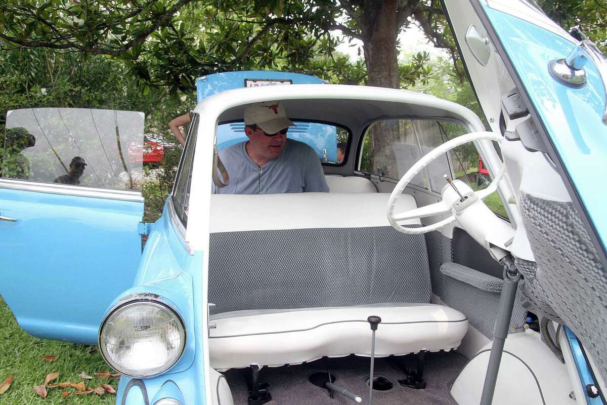 Craig Allen checks out the interior of a 1958 BMW Model 600 Sunday at the 17th annual Keels & Wheels at Seabrook. Photo by Pin Lim.