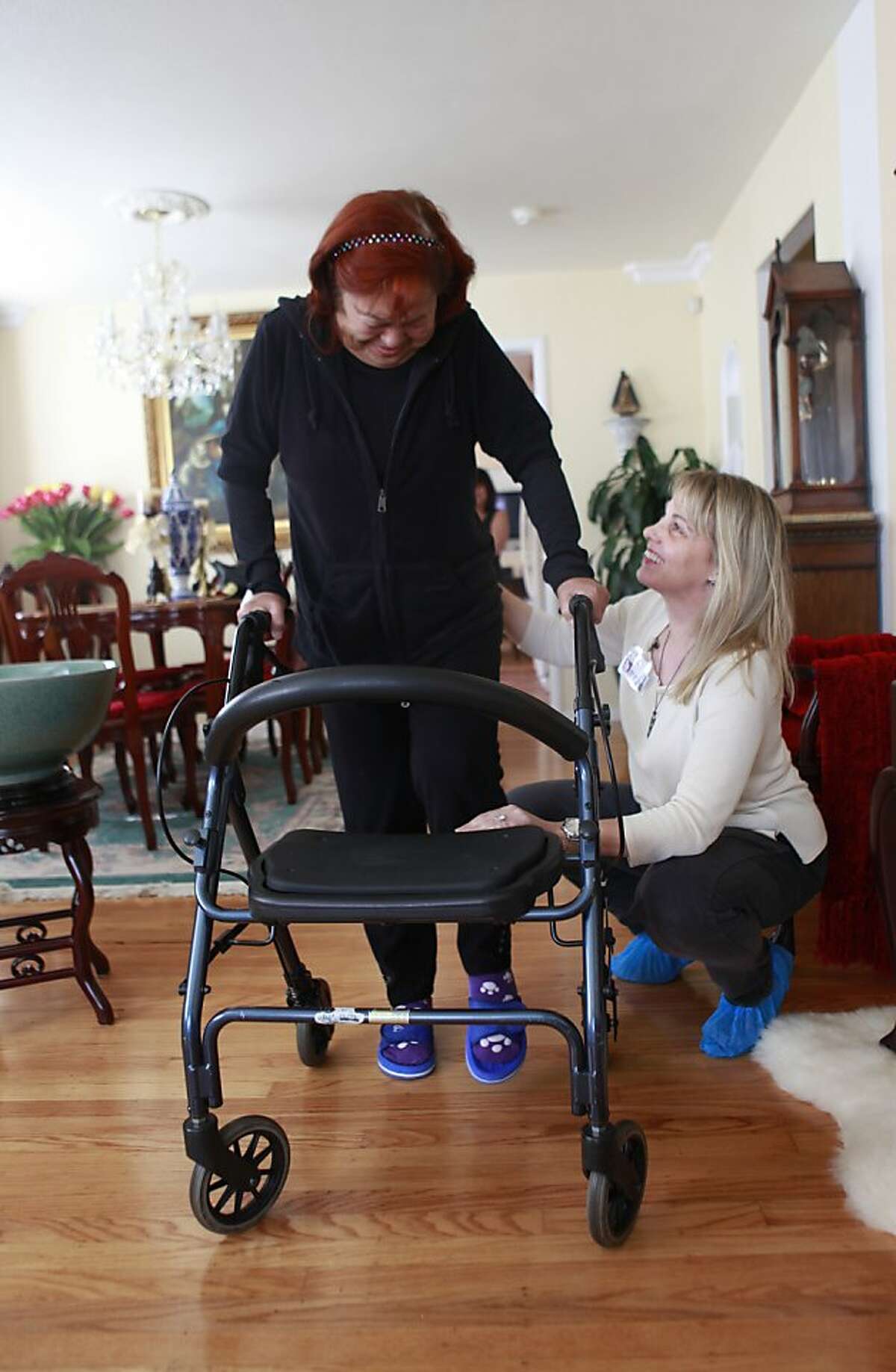 Amy Garfinkle works as a physical therapist for a home health care agency in the East Bay. She visits one of her favorite patients, Milagros Montoya, who is recovering from a full knee replacement, to help her re-learn to walk in San Leandro, Calif., on Tuesday, May 1st , 2012.