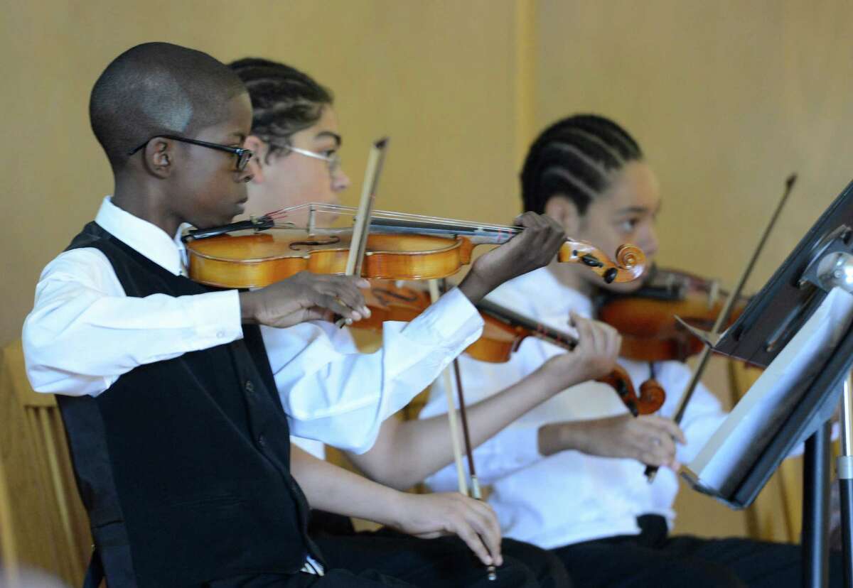 Members of the Giffen Elementary School Orchestra play during the launch of the Albany Promise initiative which is aimed at improving educational opportunities for children from the region's poorest neighborhoods at an assembly at the Giffen Elementary School in Albany, N.Y. May 7, 2012. (Skip Dickstein / Times Union)