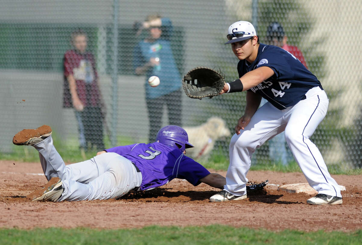 Staples first baseman Bryan Terzian reaches for the ball on a pickoff attempt against Westhill Friday. Terzian had two hits and three RBI Monday in a 14-4 victory over Danbury.