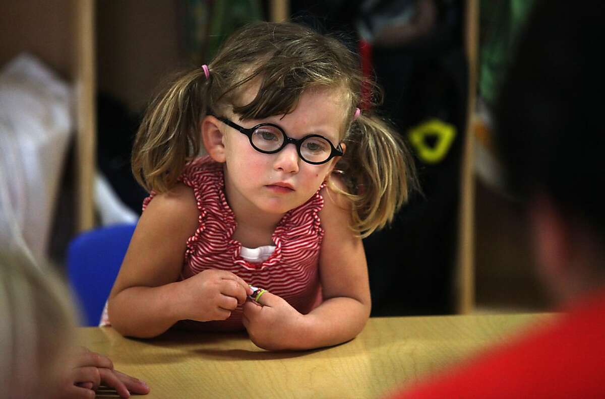 Revisiting "Potrero Kids" a preschool at Daniel Webster Elementary school that was started by neighboring parents in San Francisco, Calif., as Coco Tricamo, four years old, listens to her teacher on Tuesday, May 1, 2012.