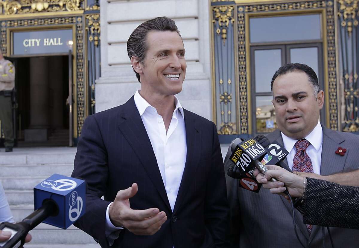 California Lt. Gov. Gavin Newsom, left, smiles next to Calif. Assembly Speaker John Perez, D-Los Angeles, right, during a news conference in front of San Francisco City Hall Tuesday, May 9, 2012 as he reacts to his support of President Barack Obama declaring his support for gay marriage. Newsom was the mayor of San Francisco when the first gay marriages were allowed in California. (AP Photo/Paul Sakuma)