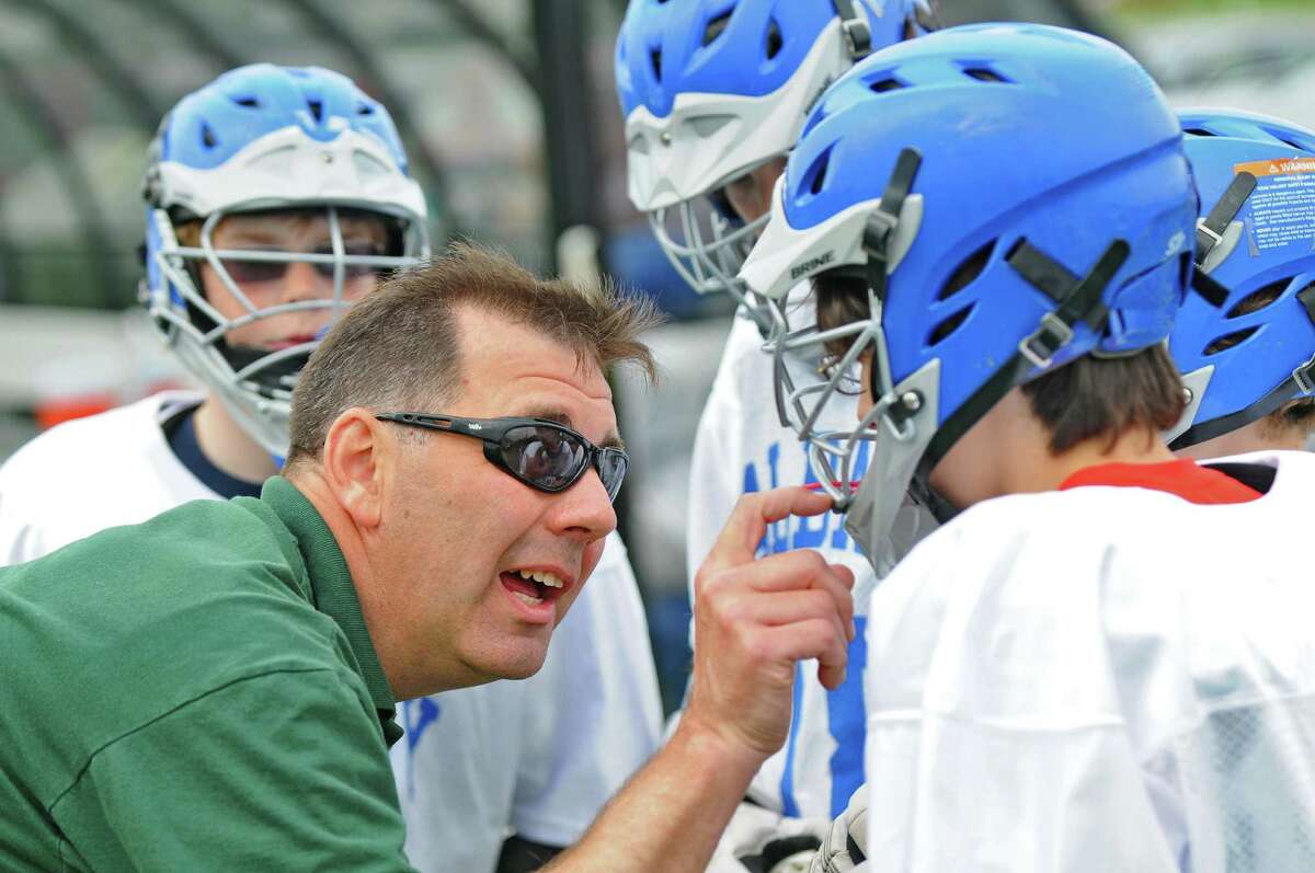 Albany Lacrosse Modified Team assistant coach Bill Andrews talks on the sidelines to some of his players during their game against CBA on Monday May 7, 2012 in Albany, NY. (Philip Kamrass / Times Union )