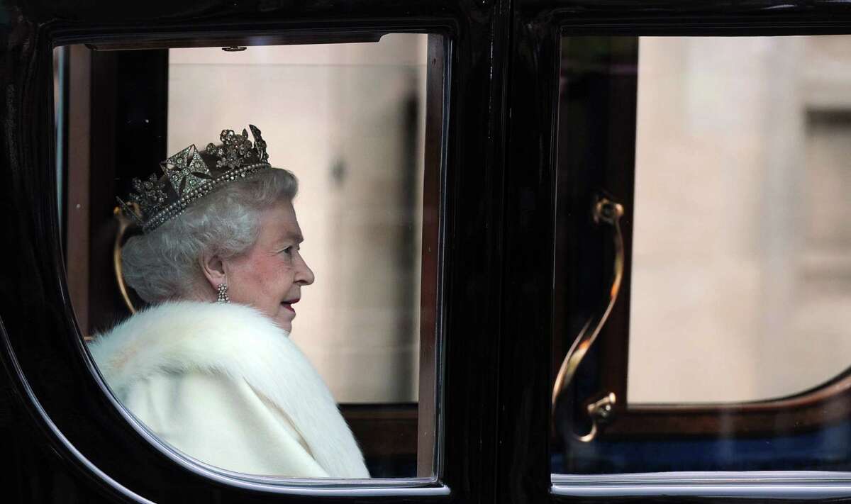 Britain's Queen Elizabeth II arrives in the Australian State Coach at the Palace of Westminster for the State Opening of Parliament in London on May 9, 2012. Britain's Queen Elizabeth II unveiled the coalition government's legislative programme in a speech delivered to Members of Parliament and Peers in the House of Lords.
