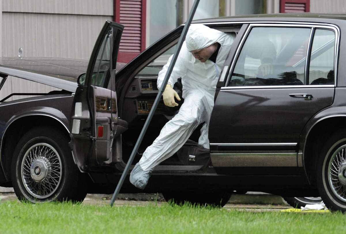 A law enforcement agent searches a vehicle at the home of reputed Connecticut mobster Robert Gentile in Manchester, Conn., Thursday, May 10, 2012. Gentile's lawyer A. Ryan McGuigan says the FBI warrant allows the use of ground-penetrating radar and believes they are looking for paintings stolen from Boston's Isabella Stewart Gardener Museum worth half a billion dollars. (AP Photo/Jessica Hill)