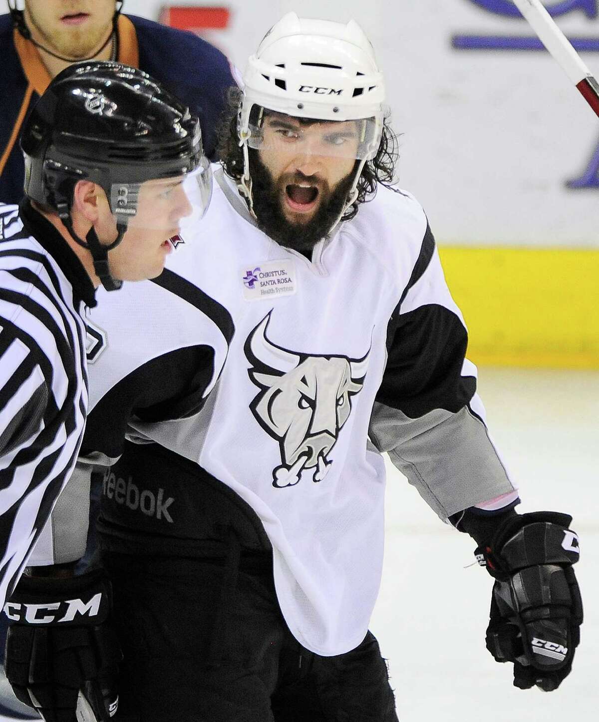 San Antonio Rampage's Scott TImmins, right, argues a call with an official during the third period of an AHL hockey game against the Oklahoma City Barons, Thursday, May 10, 2012, in San Antonio.