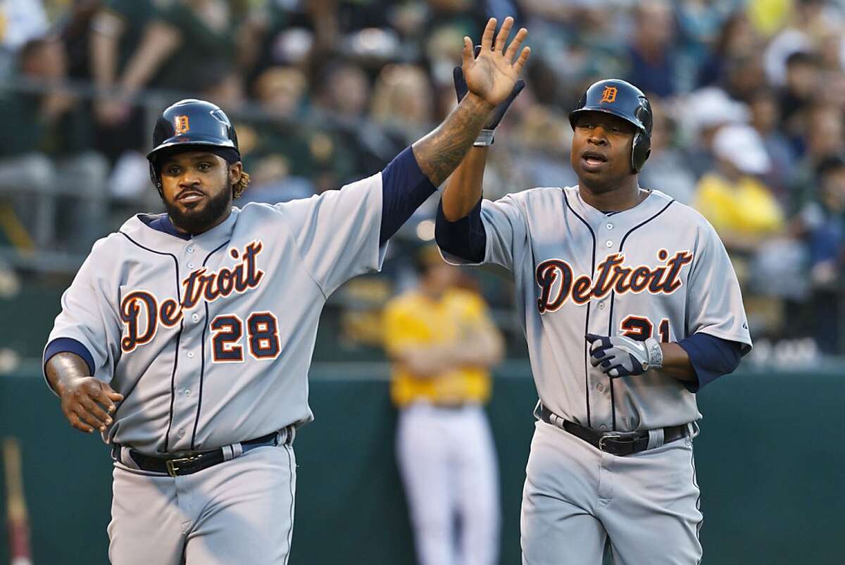 OAKLAND, CA - MAY 10: Prince Fielder #28 and Delmon Young #21 of the Detroit Tigers celebrate after scoring runs off a double hit by Alex Avila (not pictured) against the Oakland Athletics during the third inning at O.co Coliseum on May 10, 2012 in Oakland, California. (Photo by Jason O. Watson/Getty Images)
