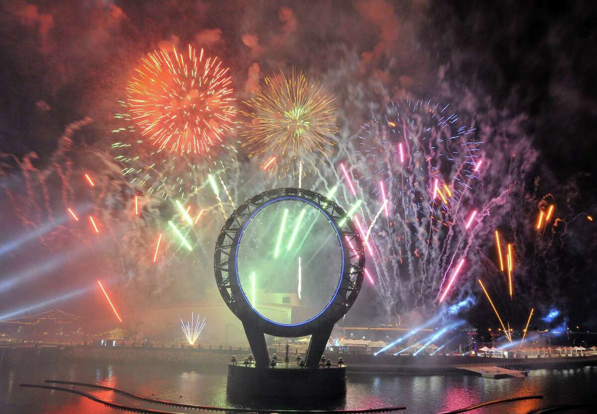 Fireworks light up over the Big-O, a giant circular structure for nightly laser and light shows, during the opening ceremony of the Expo 2012 in Yeosu, a small city on South Korea's south coast, on May 11, 2012. After four years of work and 10 billion USD in investment, an international expo will start on May 12 at a glittering hi-tech venue on the site of a former dusty cement terminal in South Korea under the theme of "The Living Ocean and Coast". AFP PHOTO / JUNG YEON-JEJUNG YEON-JE/AFP/GettyImages