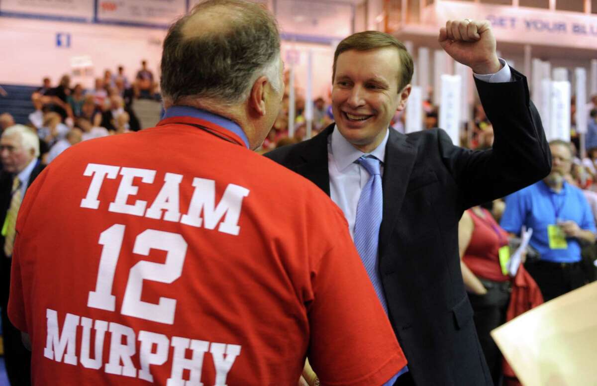 Rep. Chris Murphy talks to supporter David Gioiello, of Shelton, during the Democratic State Convention at Central Connecticut State University's Kaiser Hall in New Britain Saturday, May 12, 2012.