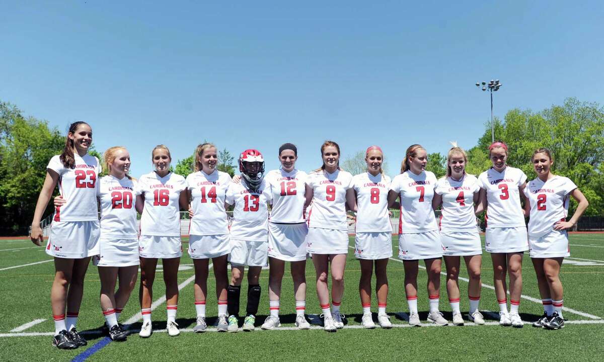 Greenwich senior girls lacrosse players honored prior to the girls high school lacrosse match against Wilton are from left, Tory Carr, Elizabeth Robben, Hayden Stein, Megan O'Leary, Hannah Jeffrey, Caroline Brennan, Mackenzie Nocek, Tori Dunster, Shannon Colligan, Izzy Mackell, Claire Feeney and Lindsay Nielsen, at Greenwich High School, May 12, 2012. Wilton won the match 18-9.