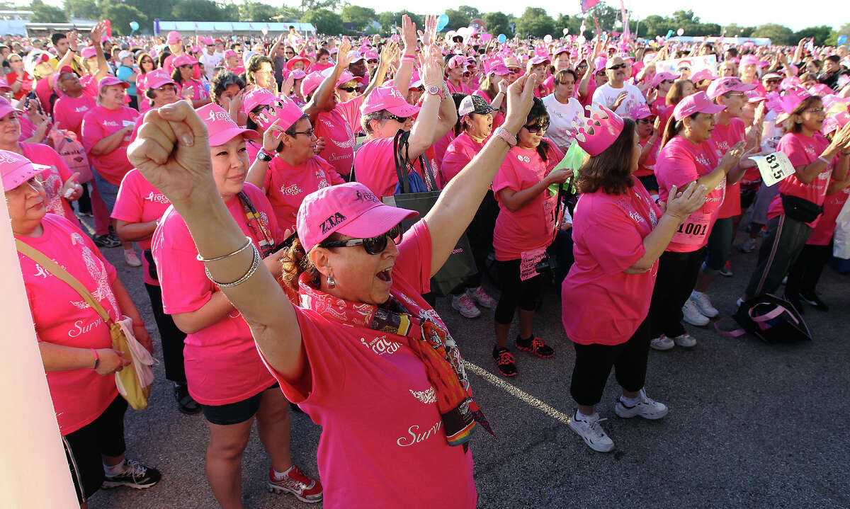 Irene Chavez (front) join other cancer survivors in cheer prior to the start of the Susan G. Komen San Antonio Race for the Cure on Saturday, May 12, 2012. Chavez said she has been free of cancer for the past five years. Kin Man Hui/Express-News.
