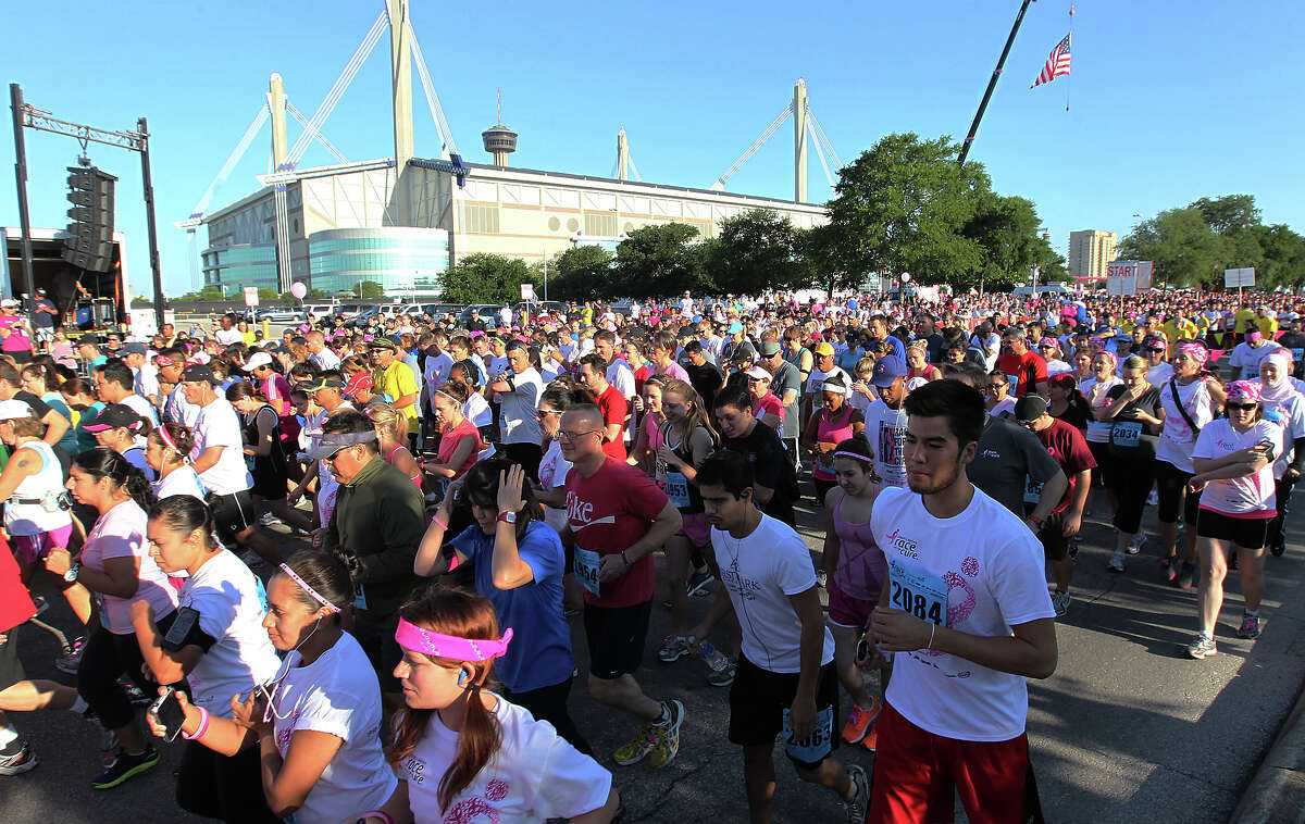 Thousands of runners fill Cherry Street near the Alamodome to start the 2012 Susan G. Komen San Antonio Race for the Cure on Saturday, May 12, 2012. Kin Man Hui/Express-News.