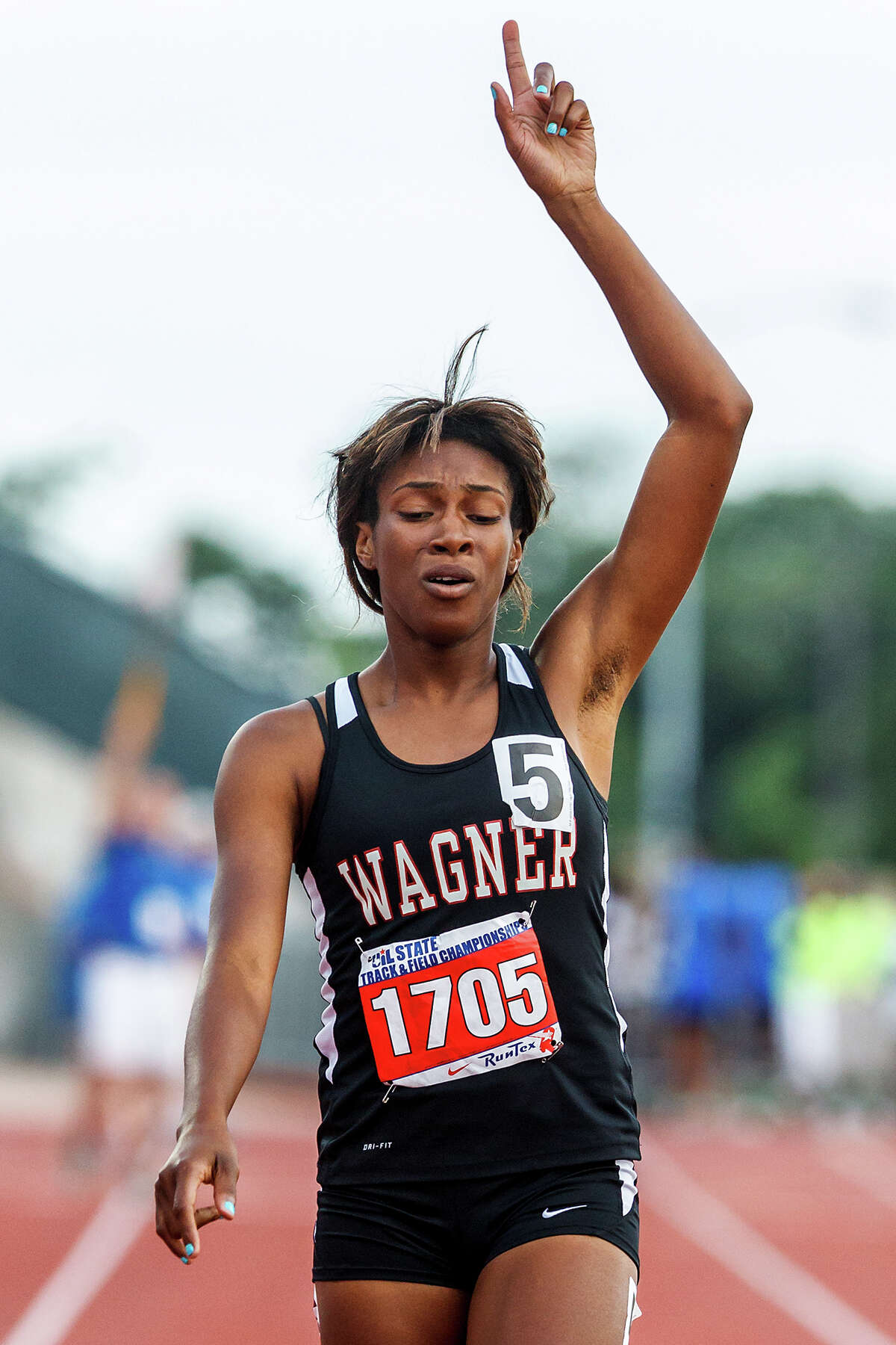 Wagner's Tiaira Carter reacts after winning the 5A girls' 400-meter dash with a time of 53.81 during the UIL state track meet at Mike A. Myers Stadium, University of Texas in Austin on May 12, 2012. MARVIN PFEIFFER/ mpfeiffer@express-news.net