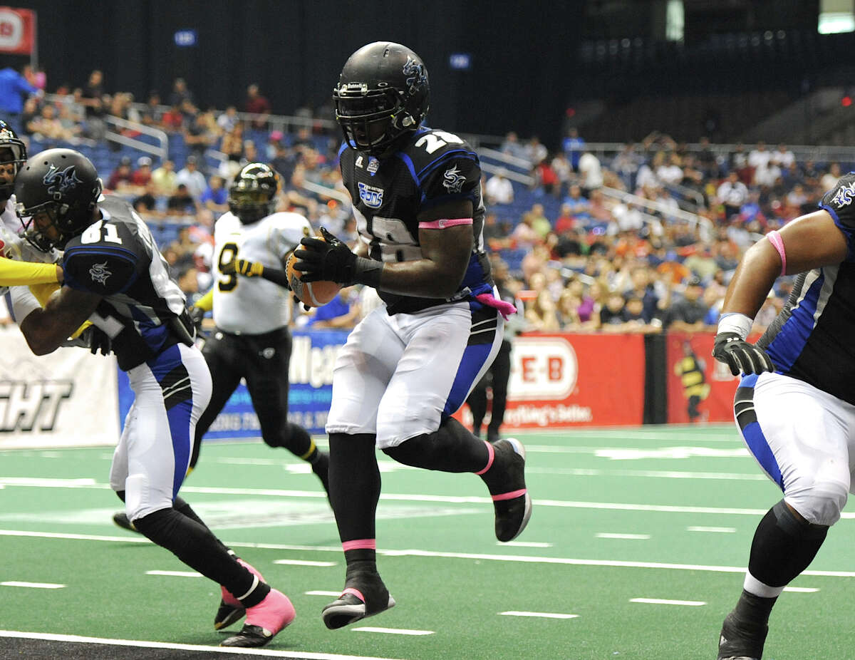 San Antonio Talons' Chad Cook (28) leaps into the endzone for a touchdown during an Arena Football League (AFL) game between the San Antonio Talons and the Pittsburgh Power on May 12, 2012 at the Alamodome in San Antonio Texas. John Albright / For the Express-News.
