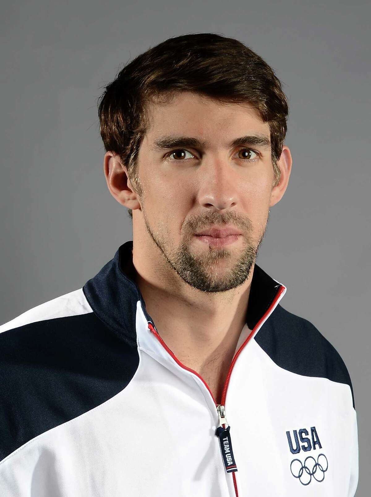 Michael Phelps of the US Olympic Swimming team poses for pictures during the 2012 Team USA Media Summit on May 13, 2012 in Dallas,Texas.AFP PHOTO/JOE KLAMARJOE KLAMAR/AFP/GettyImages