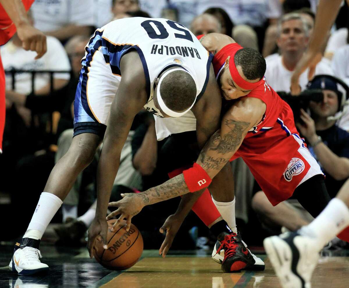 Memphis Grizzlies forward Zach Randolph (50) and Los Angeles Clippers forward Kenyon Martin, right, battle for the ball in the first half of Game 7 in a first-round NBA basketball playoff series on Sunday, May 13, 2012, in Memphis, Tenn. (AP Photo/Mark Humphrey)