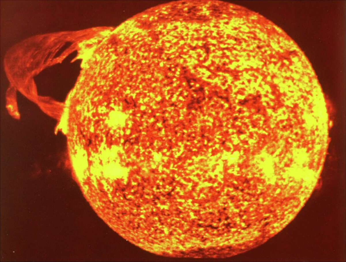 This photograph of the Sun, taken December 19, 1973, by NASA's Skylab 4, shows one of the most spectacular solar flares (upper left) ever recorded, spanning more than 367,000 miles across the solar surface. The photograph was taken in the light of ionized helium by an extreme ultraviolet spectrohelograph instrument. (AP photo/Nasa)