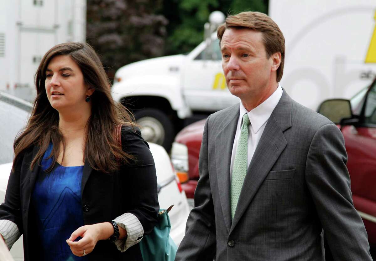 Cate Edwards walks with her father John Edwards into the federal courthouse in Greensboro, N.C., as the defense continues in John Edwards' campaign corruption trial Monday, May 14, 2012. (AP Photo/Bob Leverone)