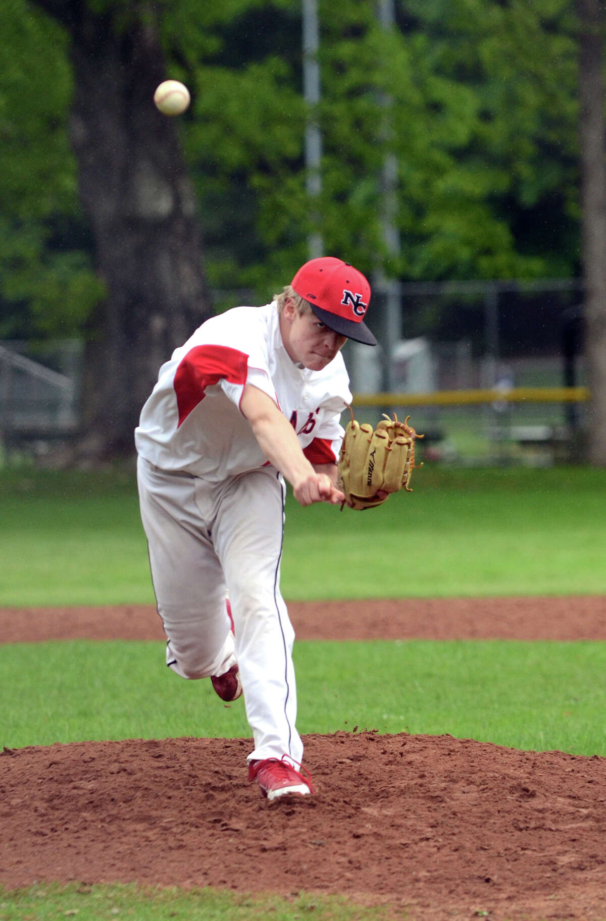 New Canaan's Jackson Anderson (22) pitches during the baseball game against Danbury High School at Mead Park in New Canaan on Monday, May 14, 2012.