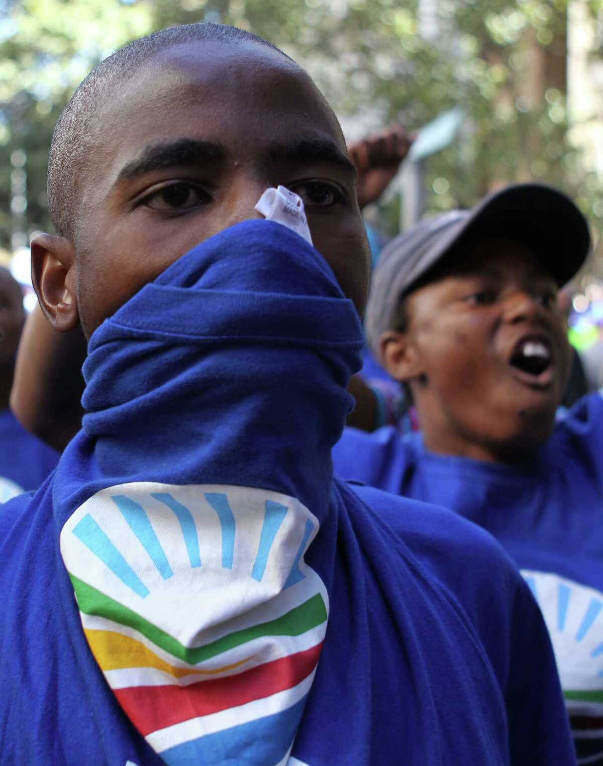 South Africa's opposition party Democratic Alliance (DA) supporters during their protest march against the Congress of South African Trade Unions (Cosatu) for opposing the youth wage subsidy in Johannesburg, South Africa on Tuesday May 15, 2012. An opposition party march in Johannesburg turned violent Tuesday after union supporters hurled rocks at the leader of South Africa's main opposition party. (AP Photo/Themba Hadebe)