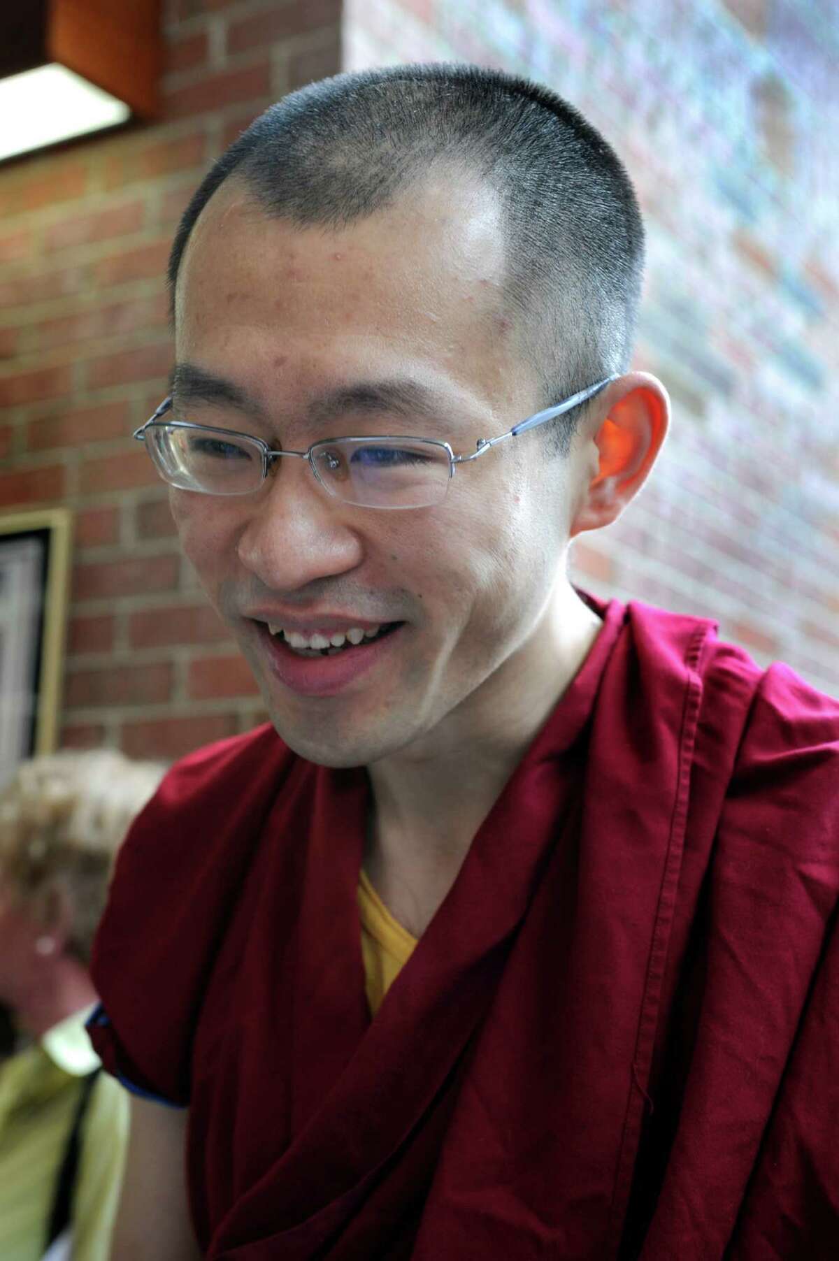 Jampa Gyaltsen, one of five monks at the DNKL Tibetan Buddhist Center for Universal Peace in Redding, is present Wednesday morning for the One Book, One Community kickoff event at City Hall in Danbury, May 16, 2012.